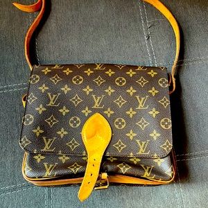 Louis Vuitton Cartouchiere shoulder purse.